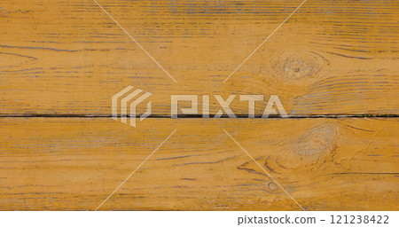 Weathered yellow painted wooden planks with knots and grain 121238422