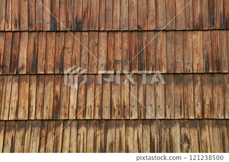 Old weathered wooden shingles creating rustic texture Old weathered wooden shingles creating rustic texture 121238500