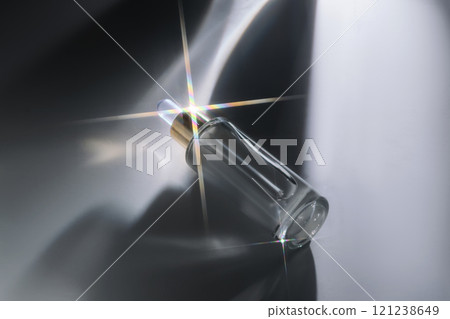 Bottle of face serum with a pipette with a beautiful highlight. 121238649