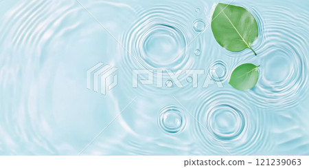 A green leaf floating on water showing ripples and bubbles, suitable as SPA background 121239063