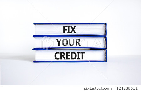 Fix your credit symbol. Concept words Fix your credit on books on a beautiful white table white background. Business, finacial and fix your credit concept. Copy space. Fix your credit symbol. Concept words Fix your credit on books on a beautiful white table white background. Business, finacial and fix your credit concept. Copy space. 121239511