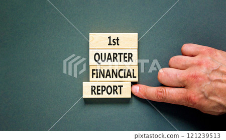 1st quarter financial report symbol. Concept words 1st quarter financial report on beautiful wooden blocks. Beautiful grey background. Business 1st quarter financial report concept. Copy space. 121239513
