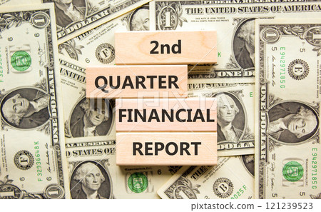 2nd quarter financial report symbol. Concept words 2nd quarter financial report on beautiful wooden blocks. Beautiful dollar background. Business 2nd quarter financial report concept. Copy space. 2nd quarter financial report symbol. Concept words 2nd quarter financial report on beautiful wooden blocks. Beautiful dollar background. Business 2nd quarter financial report concept. Copy space. 121239523