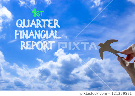 1st quarter financial report symbol. Concept words 1st quarter financial report. Beautiful blue sky and clouds background. Businessman hand. Business 1st quarter financial report concept. Copy space. 1st quarter financial report symbol. Concept words 1st quarter financial report. Beautiful blue sky and clouds background. Businessman hand. Business 1st quarter financial report concept. Copy space. 121239551
