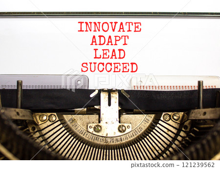 Innovate adapt lead succeed symbol. Concept words Innovate Adapt Lead Succeed typed on beautiful old typewriter. Beautiful white background. Business innovate adapt lead succeed concept. Copy space. 121239562
