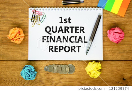 1st quarter financial report symbol. Concept words 1st quarter financial report on beautiful white note. Beautiful wooden background. Business 1st quarter financial report concept. Copy space. 121239574