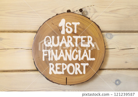 1st quarter financial report symbol. Concept words 1st quarter financial report on beautiful wooden circle. Beautiful wooden wall background. Business 1st quarter financial report concept. Copy space. 121239587