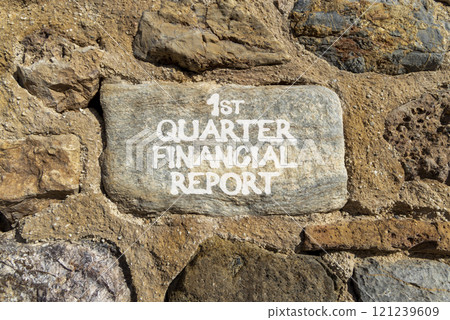 1st quarter financial report symbol. Concept words 1st quarter financial report on beautiful grey stone. Beautiful stone wall background. Business 1st quarter financial report concept. Copy space. 121239609