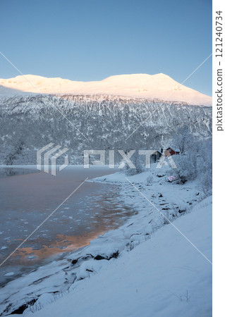 Nature with snow and houses, Gratangsbotn, Norway 121240734