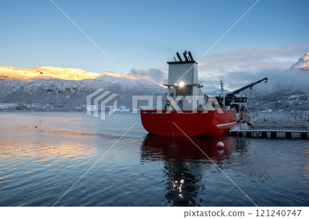 Red boat in a harbor in fjord, Gratangen, Norway 121240747