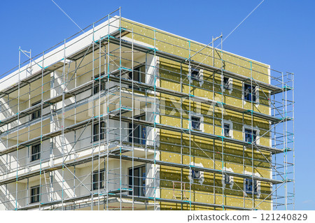 Thermal insulation of the facade of a apartment building with mineral wool plates 121240829
