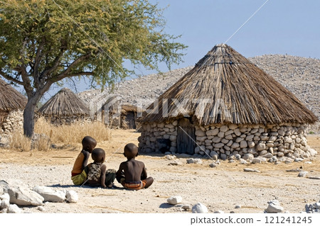 Himba children sitting on the ground in a village in namibia Himba children sitting on the ground in a village in namibia 121241245