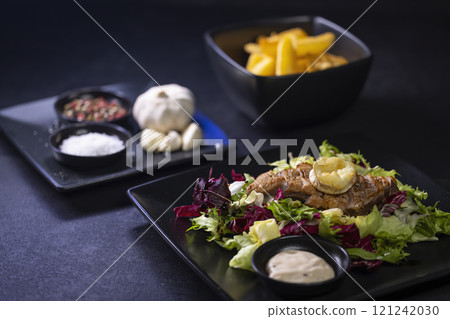 Duck breast with salad and baked goat cheese Duck breast with salad and baked goat cheese 121242030