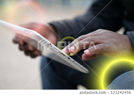African american man uses tablet computer. Black man hands holds tablet pc 121242456
