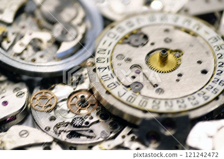 Old mechanical watches with gears and cogs. Watch or clock mechanisms 121242472