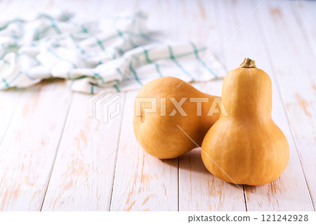 butternut pumpkin on a white table, selective focus. 121242928