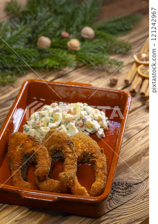 Traditional Christmas dinner in Czech Republic - fried carp with potato salad 121242967
