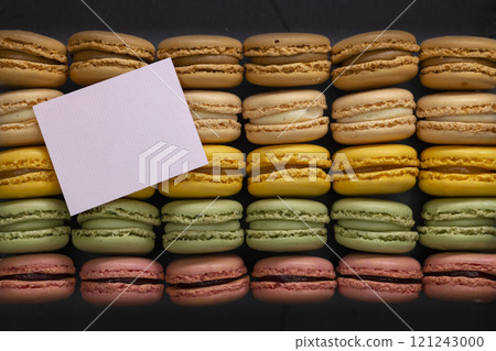 macaroons of different colors on a black background macaroons of different colors on a black background 121243000