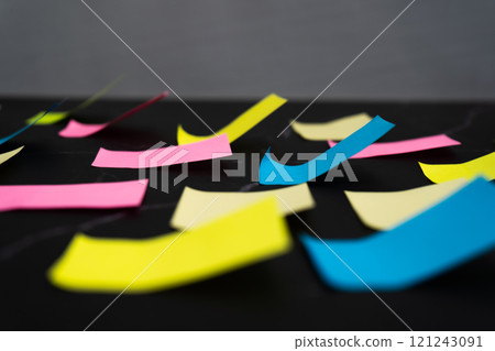 Colorful sticky notes arranged on black surface for creative idea organization Colorful sticky notes arranged on black surface for creative idea organization 121243091