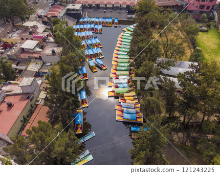 Aerial Drone Shot of Colorful Boats in Xochimilco. Tours by cannels with floating gardens in Mexico City CDMX, Mexico 121243225
