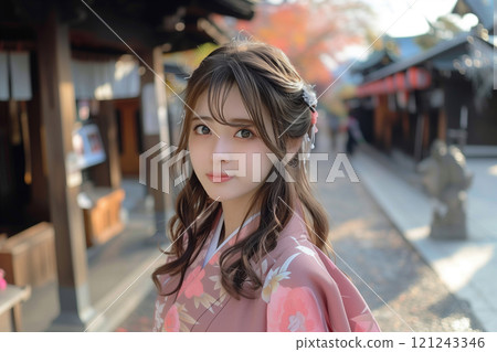 A woman wearing a beautiful furisode kimono and exuding a Japanese atmosphere at her coming-of-age ceremony 121243346