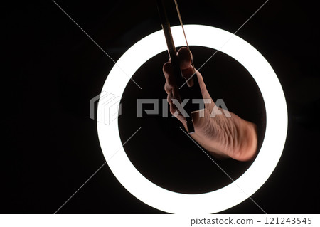 female legs with a violin bow in close-up in a round lamp. the concept of playing the violin .foot fetishism 121243545