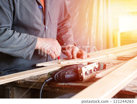 Measuring wooden slot and key boards and drawing with pencil line Measuring wooden slot and key boards and drawing with pencil line 121244263