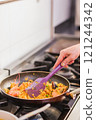 Chef cooking traditional ecuadorian seafood rice dish in madrid restaurant kitchen 121244342