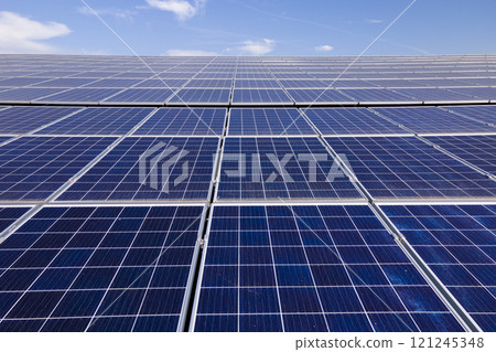 Photovoltaic panels for producing clean ecological electric energy. Commercial building with solar roof. Renewable electricity with zero emission concept 121245348