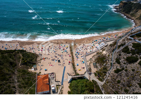 Aerial drone view of anonymous tourists at scenic 121245416