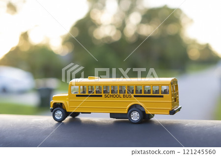 Little model of american yellow school bus outdoor. Concept of education safety in the USA 121245560