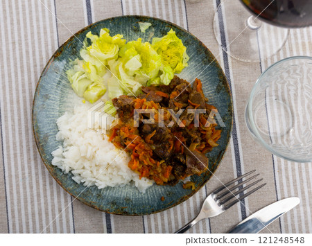 Chicken heart served with lettuce and rice Chicken heart served with lettuce and rice 121248548