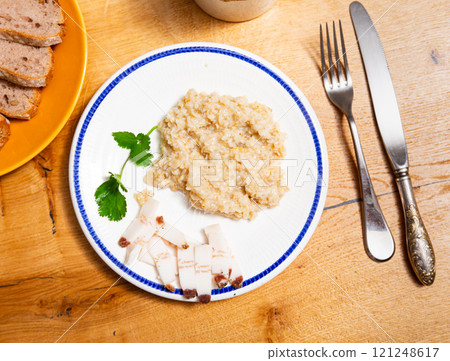 Lard with hot oatmeal and parsley. Hearty healthy dish 121248617