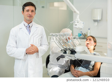 Adult male nurse in dental office Adult male nurse in dental office 121248910