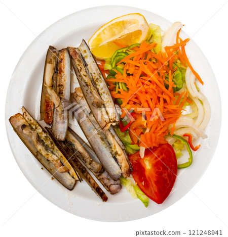 Baked razor clams with fresh vegetable salad and lemon Baked razor clams with fresh vegetable salad and lemon 121248941