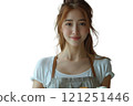 A woman wearing an apron is holding a cupcake in her hand at an event 121251446