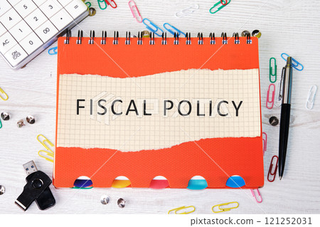 The concept of business and development. The conceptual inscription of the FISCAL POLICY written on a piece of paper from a notebook The concept of business and development. The conceptual inscription of the FISCAL POLICY written on a piece of paper from a notebook 121252031