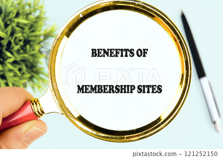 Business concept. The conceptual text BENEFITS OF MEMBERSHIP SITES through a magnifying glass, close-up, front view Business concept. The conceptual text BENEFITS OF MEMBERSHIP SITES through a magnifying glass, close-up, front view 121252150