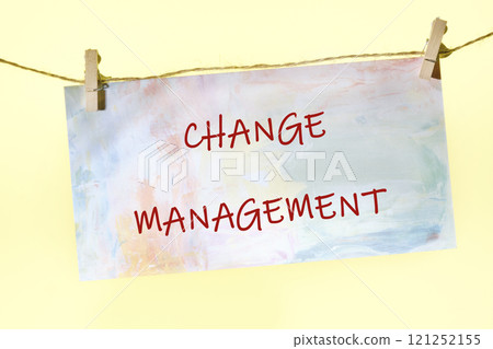 development and career growth or change yourself concept. CHANGE MANAGEMENT on a piece of paper fastened with clothespins on a rope on a yellow background 121252155