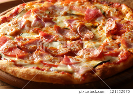 Close-up of delicious freshly baked pizza with sausages Close-up of delicious freshly baked pizza with sausages 121252970
