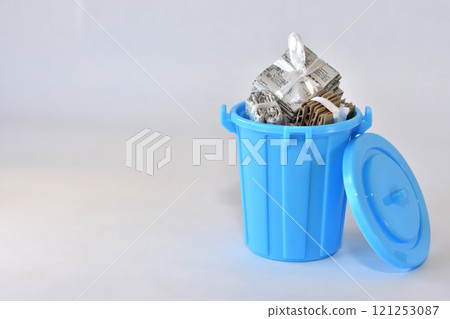 Image of recyclable waste dumped in a plastic bucket 121253087