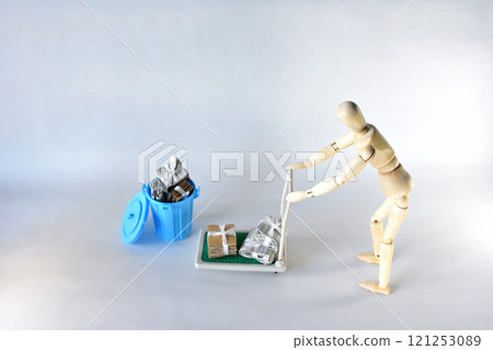 Image of a doll carrying recyclable waste on a cart Image of a doll carrying recyclable waste on a cart 121253089