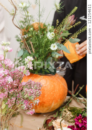Creating a floral composition in a pumpkin. Making decor with your own hands. 121254611
