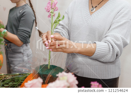 Creating a floral composition in a pumpkin. Making decor with your own hands. Creating a floral composition in a pumpkin. Making decor with your own hands. 121254624