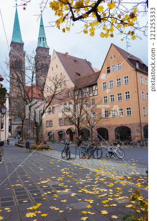Nuremberg. Germany - 11/17/2021: Nuremberg cityscape. Old town of Nuremberg with church of St. Sebald. Nuremberg historical downtown street. Bicycles on city streets. Urban lifestyle 121255333