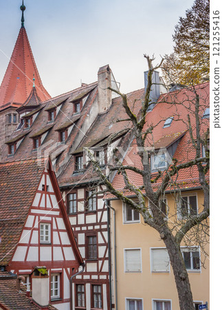 Bavarian traditional houses called fachwerkhaus. Medieval architecture. Exterior of ancient timbered buildings. Nuremberg landmark. Half-timbered houses in old town. Facade of historical german houses Bavarian traditional houses called fachwerkhaus. Medieval architecture. Exterior of ancient timbered buildings. Nuremberg landmark. Half-timbered houses in old town. Facade of historical german houses 121255416