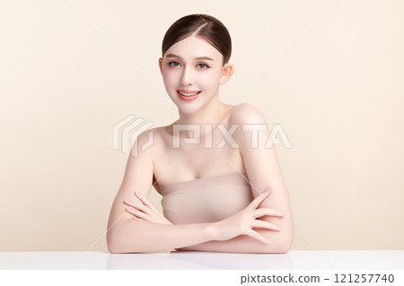 Beautiful young asian woman with clean fresh skin on beige background, Face care, Facial treatment, Cosmetology, beauty and spa, Asian women portrait. 121257740