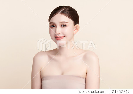 Beautiful young asian woman with clean fresh skin on beige background, Face care, Facial treatment, Cosmetology, beauty and spa, Asian women portrait. 121257742