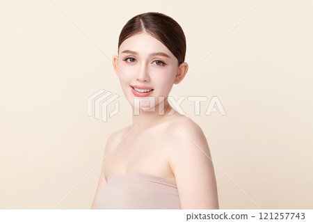 Beautiful young asian woman with clean fresh skin on beige background, Face care, Facial treatment, Cosmetology, beauty and spa, Asian women portrait. 121257743