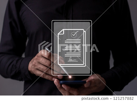 Young man with smartphone mobile hand using a pen touching to sign a Online Business Contract 121257882